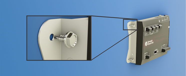 Attaching the Synergis Cloud Link using self-drilling screws.