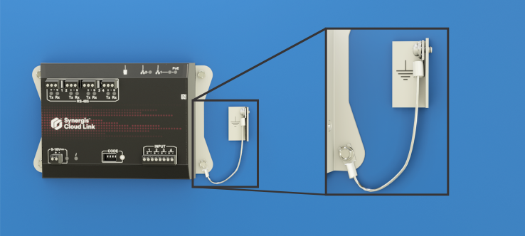 Synergis Cloud Link grounded using a ground wire to a ground terminal.